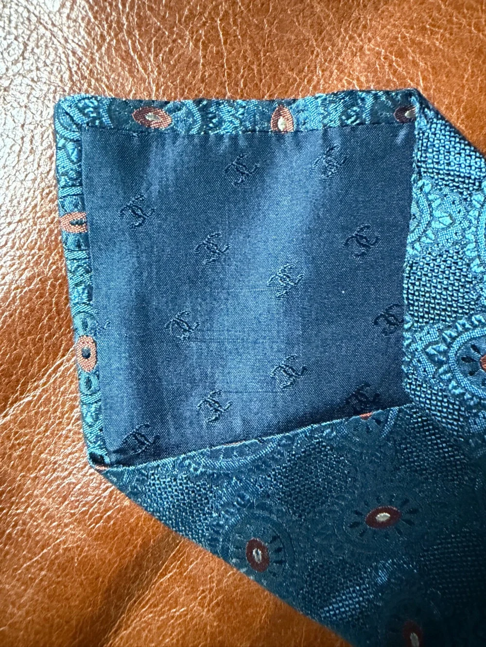 CHANEL Midnight Blue Silk Tie with Circular Terracota Medallion Motif